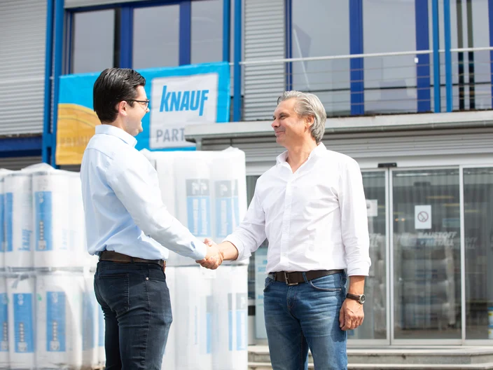 Customer and employee shaking hands