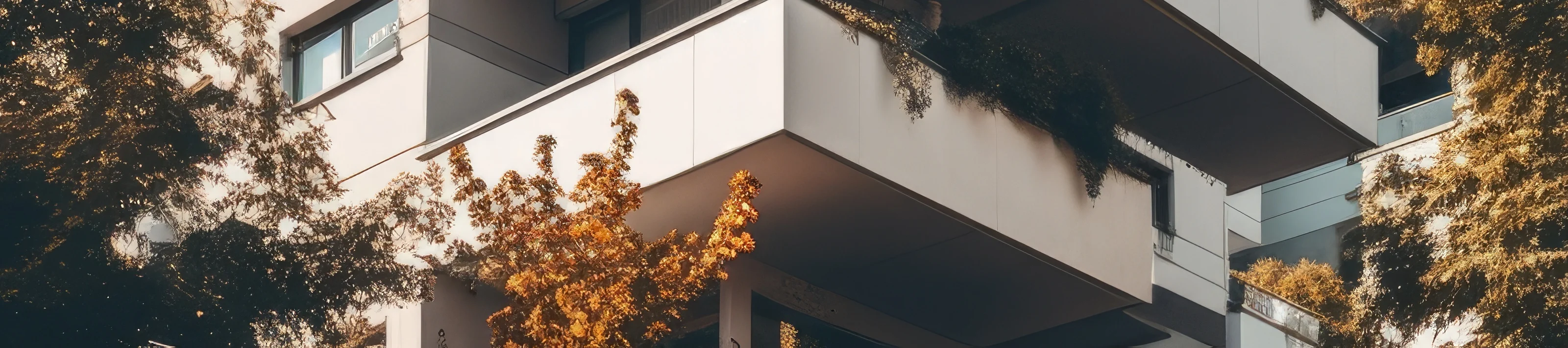 Tall apartment building with nearby trees featuring a sleek facade in a high quality photo