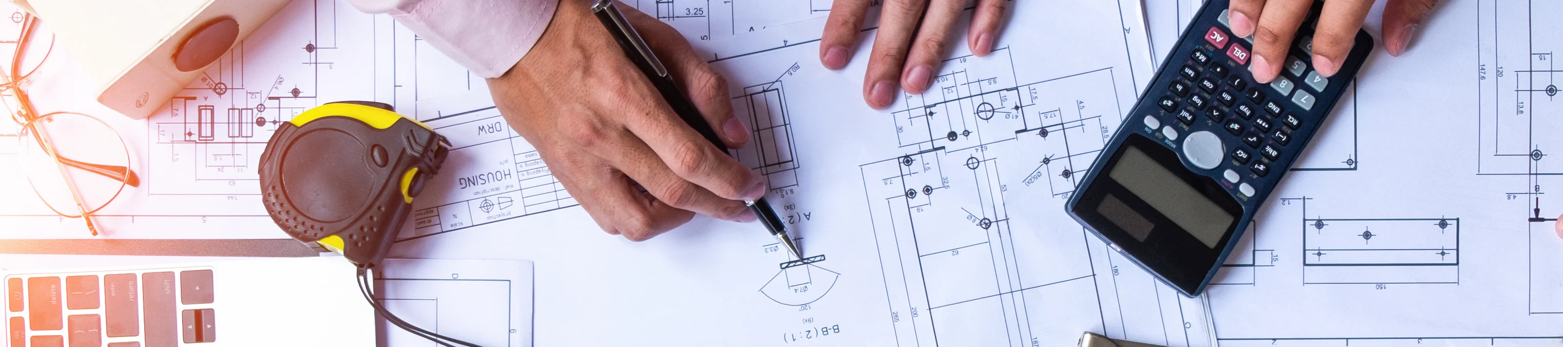 engineers pointing to building on blueprint and using laptop to drawing design building Pr