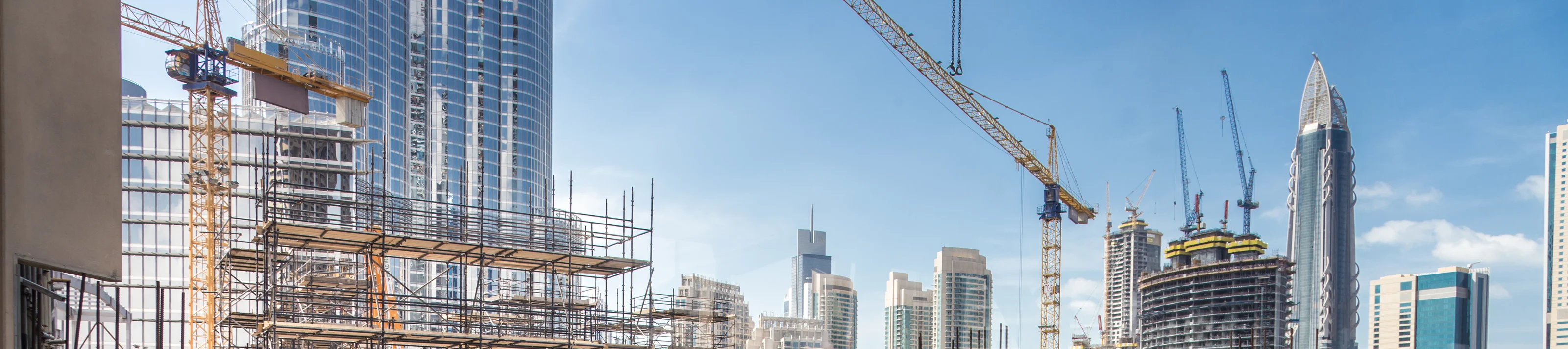 Laborers working on modern constraction site works in Dubai. Fas