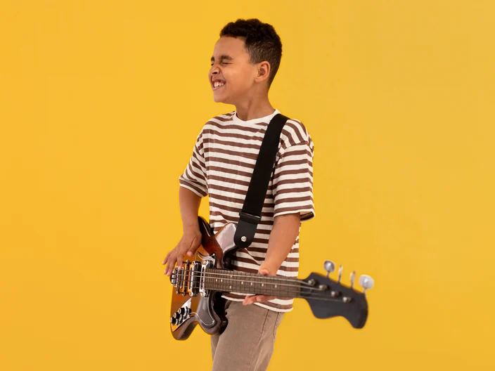 Young boy with an electric guitar