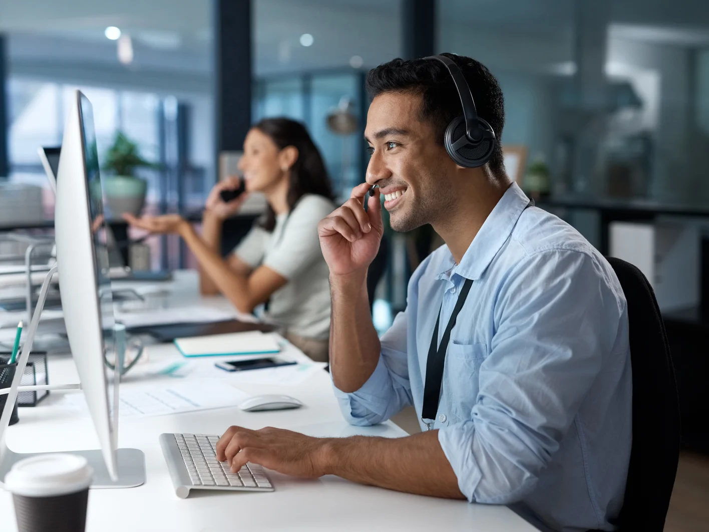 Dedicated service creates dedicated customers Shot of a young man using a headset and com