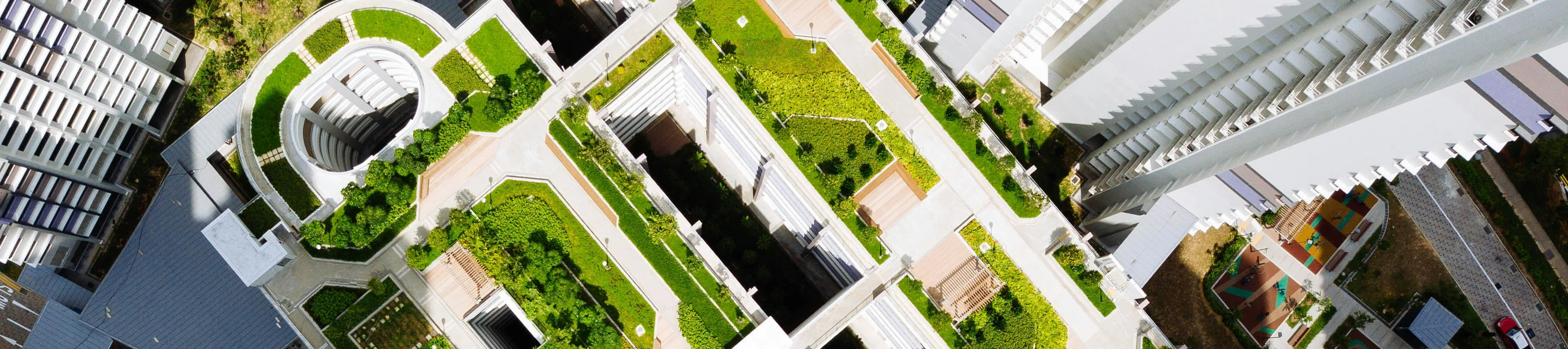 Aerial view of building with greenery on roof