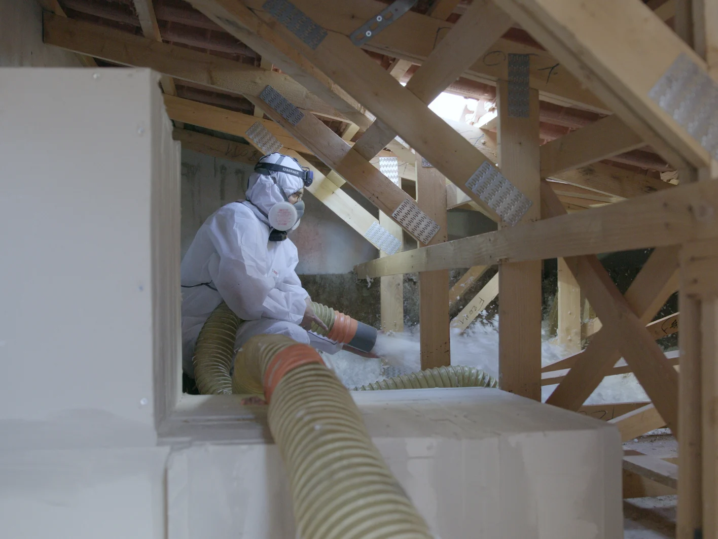Installer blowing Supafil attic