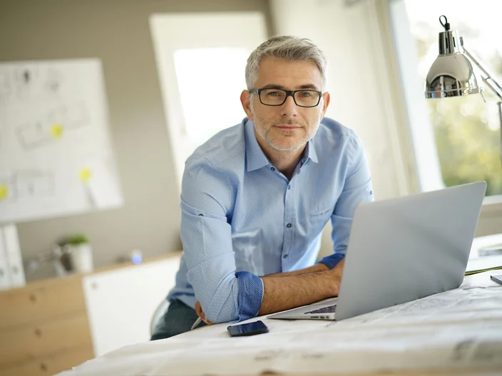 Portrait of architect looking at camera in office