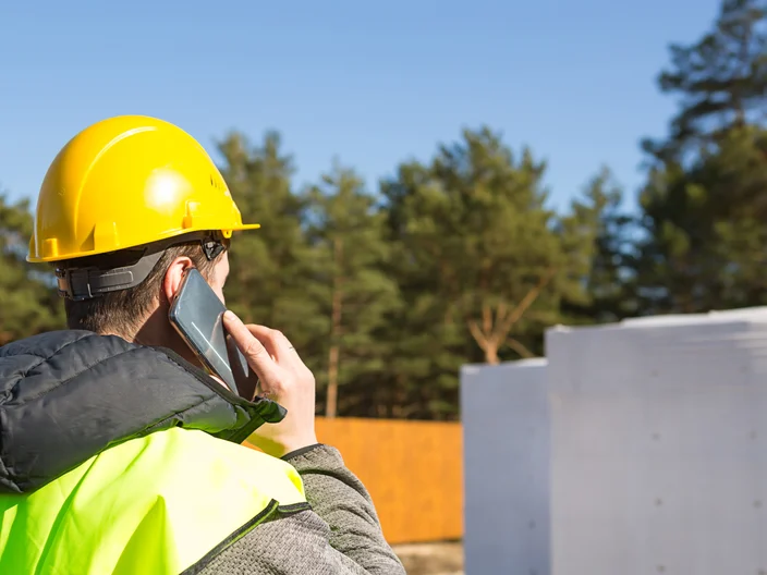 Builder Talking On Phone