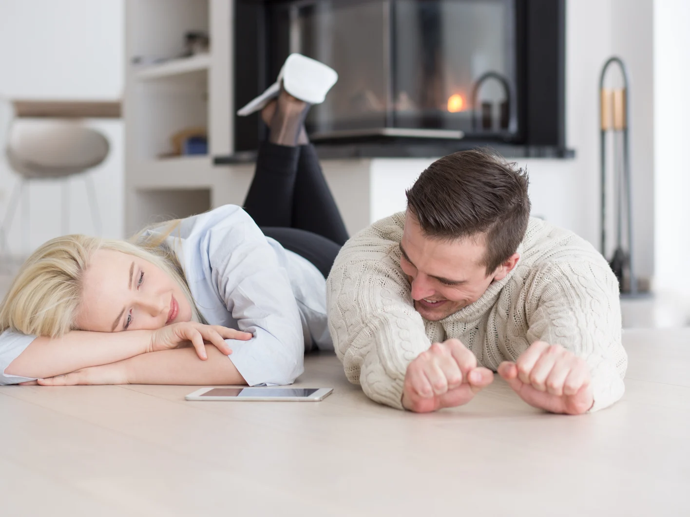 Young Couple using digital tablet on cold winter day