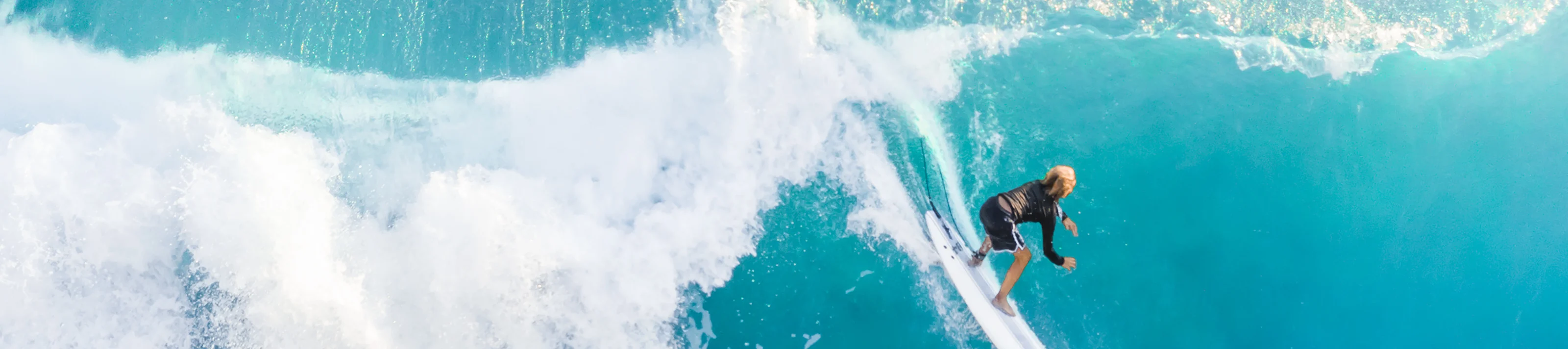 Surfer on the crest of the wave, top view