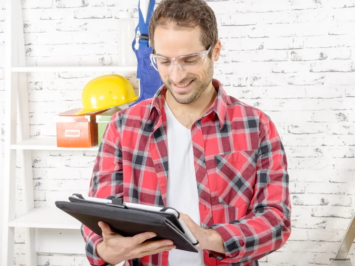 Man looking at tablet for instruction