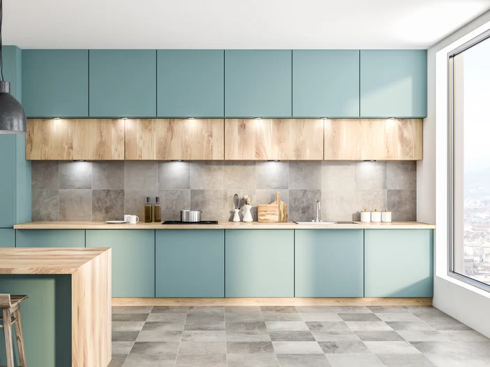 Green kitchen with counters and bar