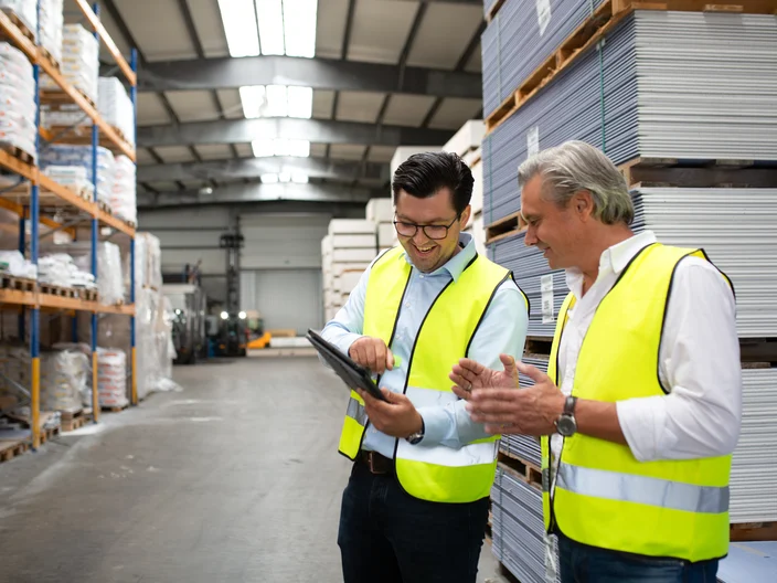 Customer and employee in warehouse