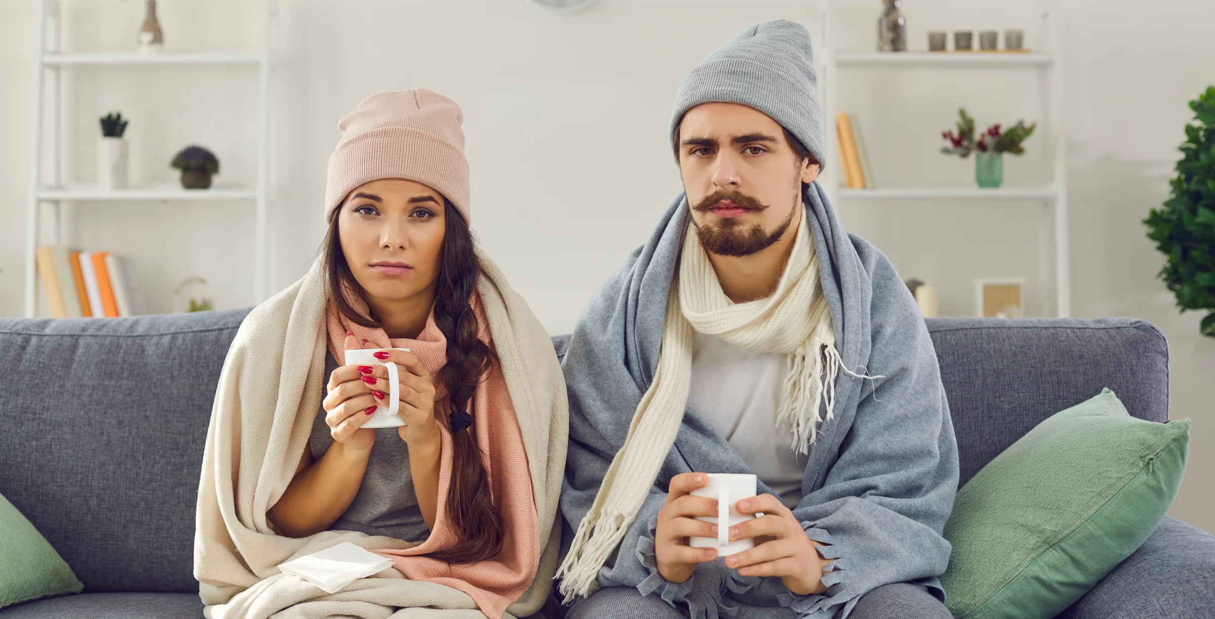 Two people indoors and cold