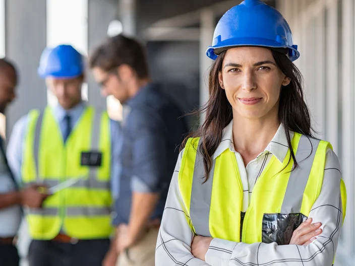 Confident architect at construction site