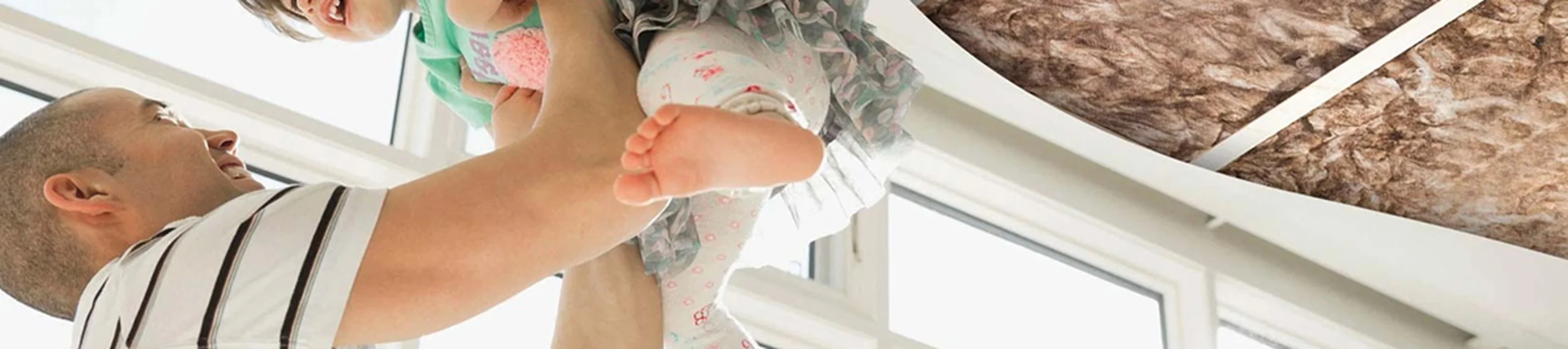 Ceiling Insulation Cutaway with Father and Daughter