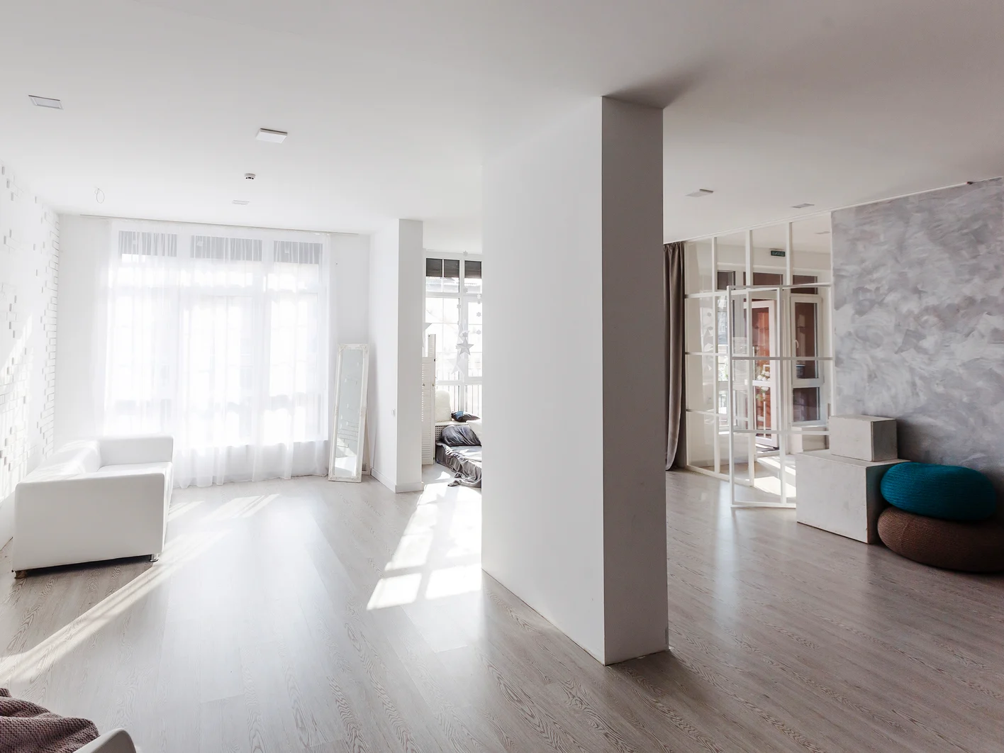 Newly renovated generic empty office space with leftover materials and ladder in foreground