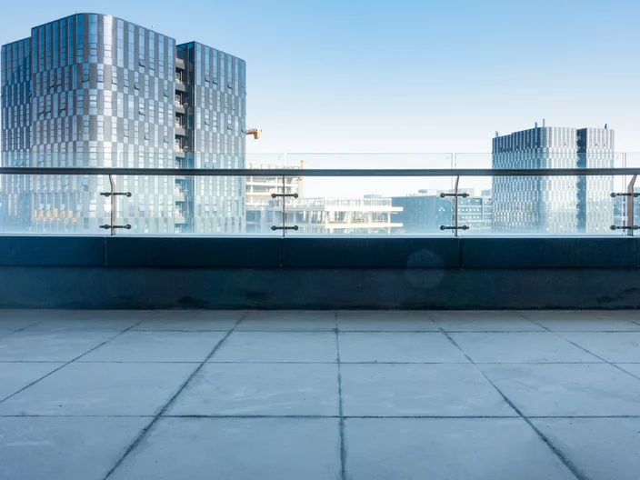Roof top balcony in the building with cityscape background