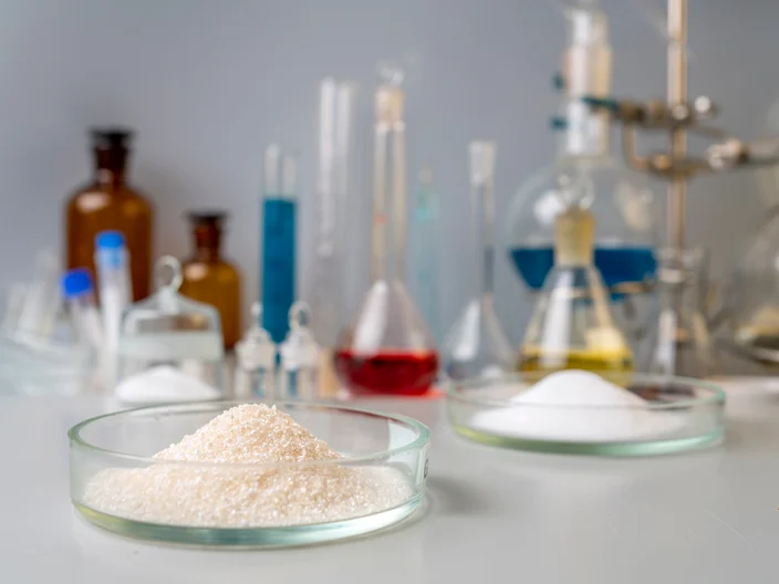 Sport Nutrition Supplement in lab. Creatine powder and amino BCCA on lab background