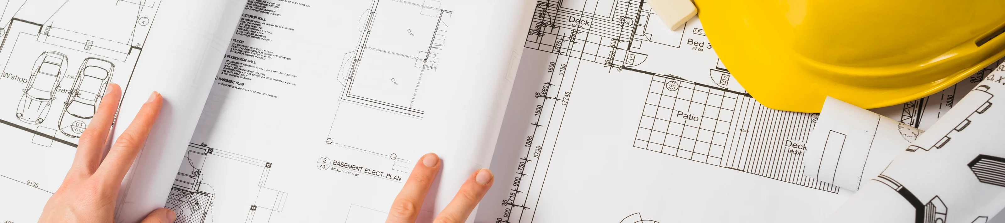 Architect Opening A Blueprint