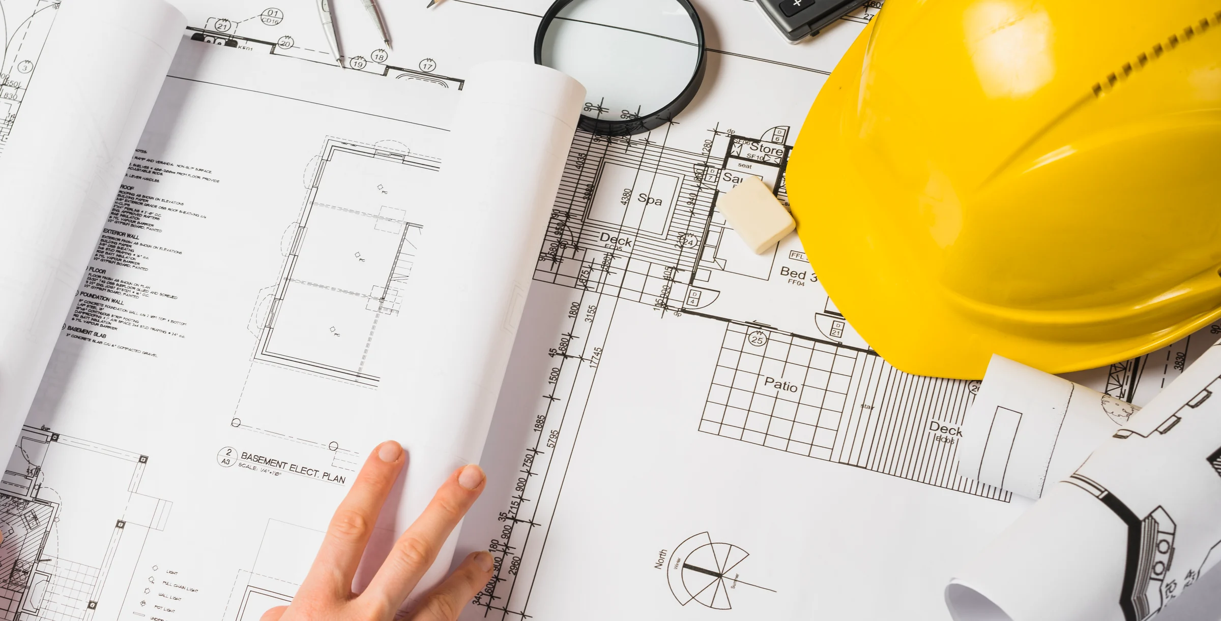 Architect Opening A Blueprint