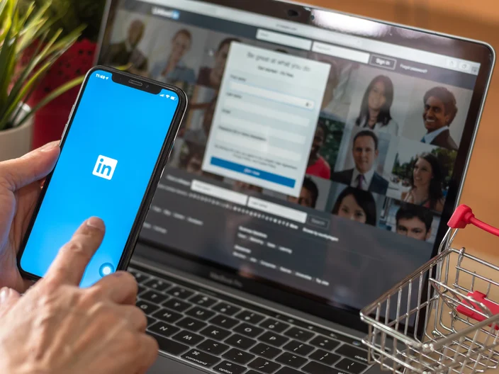 BANGKOK, THAILAND - December 29, 2018: LinkedIn human resource,  business and employment-oriented service for job career search app on mobile smart phone on iPhone device in person's hand at work