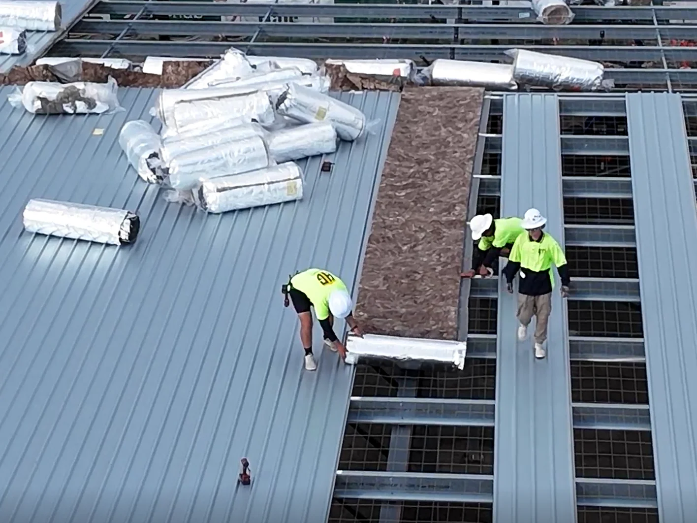 Metal roof insulation installation