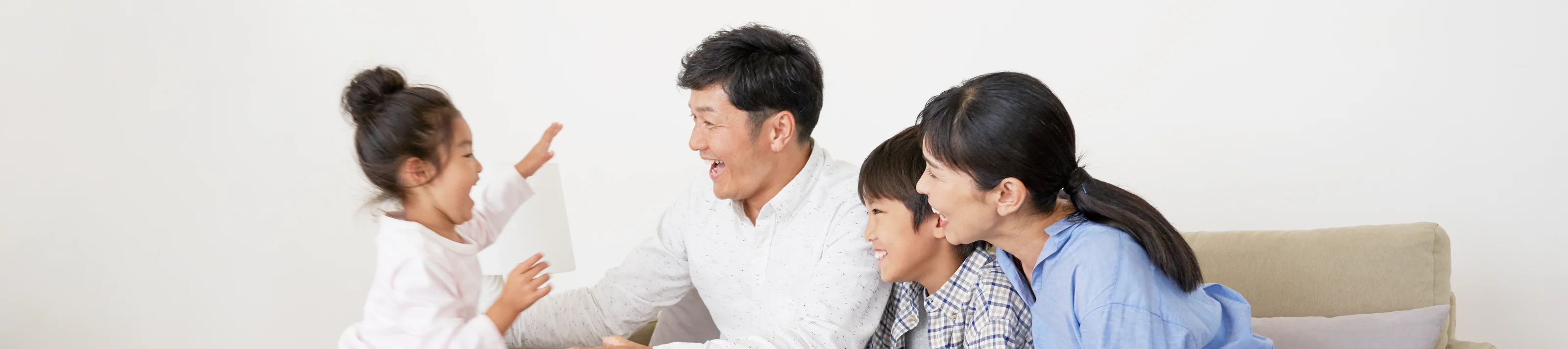 Japanese family sitting on the couch