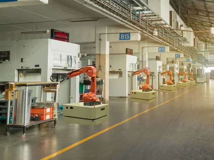 iot smart industry 4.0 concept. Automation robotic arm working i
