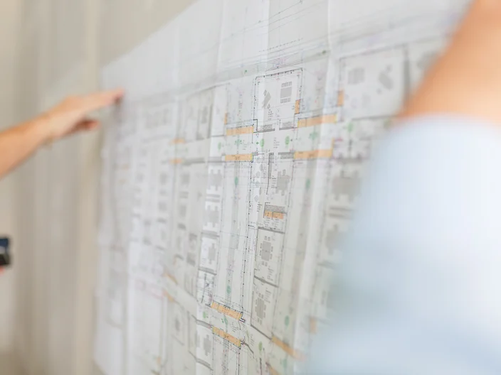Construction site with plans drawing 