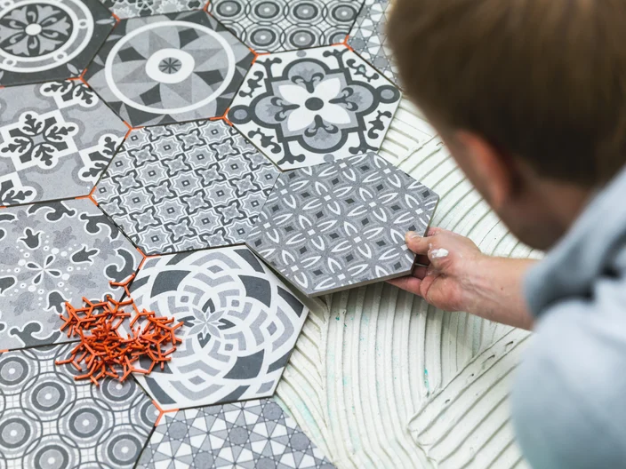 tiler laying floor tiles