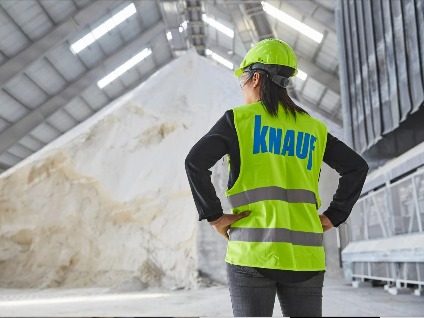 Raw Gypsum Pile and Knauf Worker