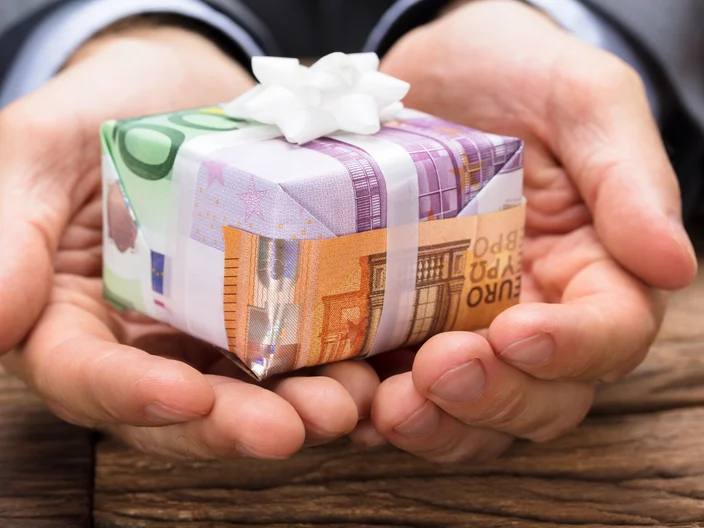 Businessman Holding Gift Box Made From Euro Papernotes
