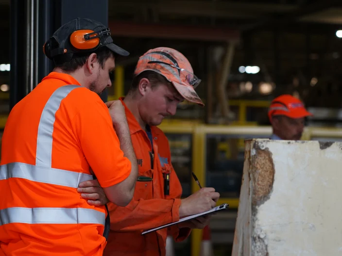 Knauf UK and Ireland Safety Day 2025-Two Knauf Sittingbourne employees looking at clipboar