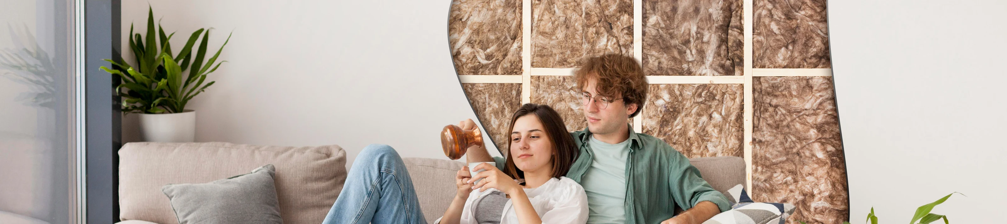 Couple sitting on couch with wall insulation