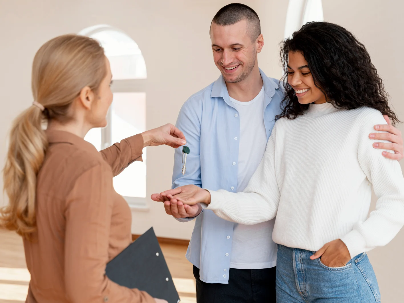 Landlord giving keys to tenants