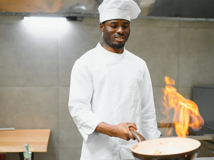 Person cooking with fire
