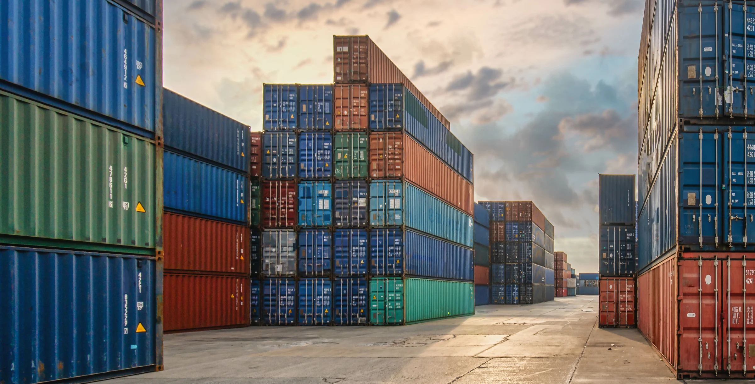 perspective view of containers at containers yard with forklift and truck