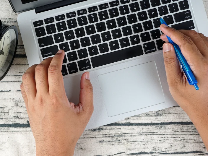 Person typing on a computer