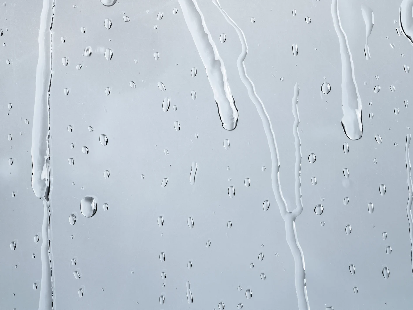 Water texture background, rainy window on cloudy day