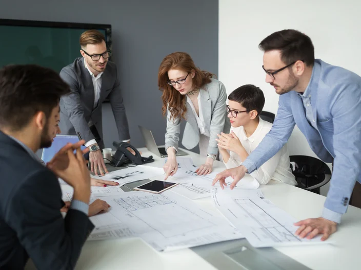 Group of architects working on project in office