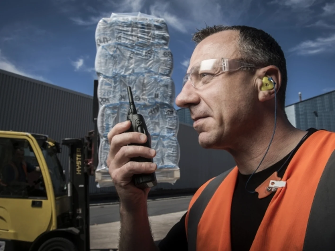 man on walkie talkie at construction site St Helens