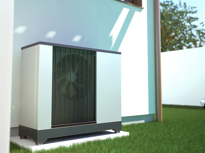 Air heat pump beside house 