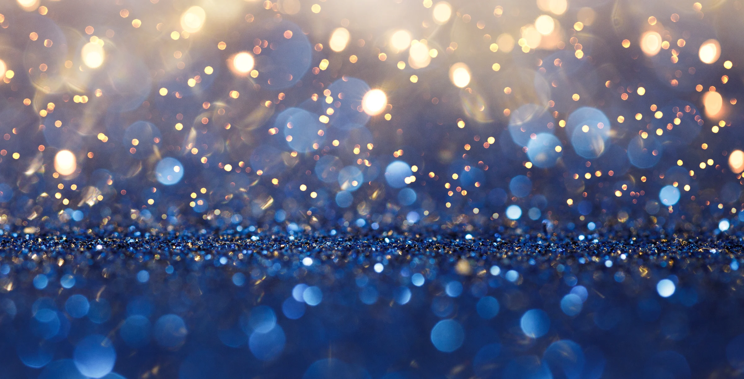 Vintage lights background. Gold lights and blue glitter. defocused